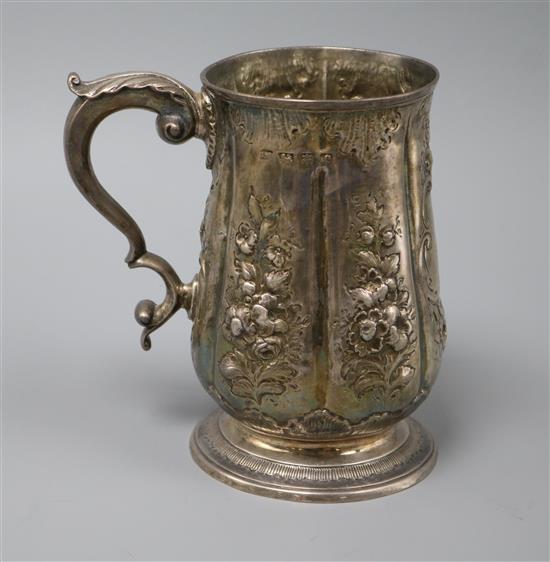 A George III later embossed silver mug, London, 1781, 10.5 oz.
